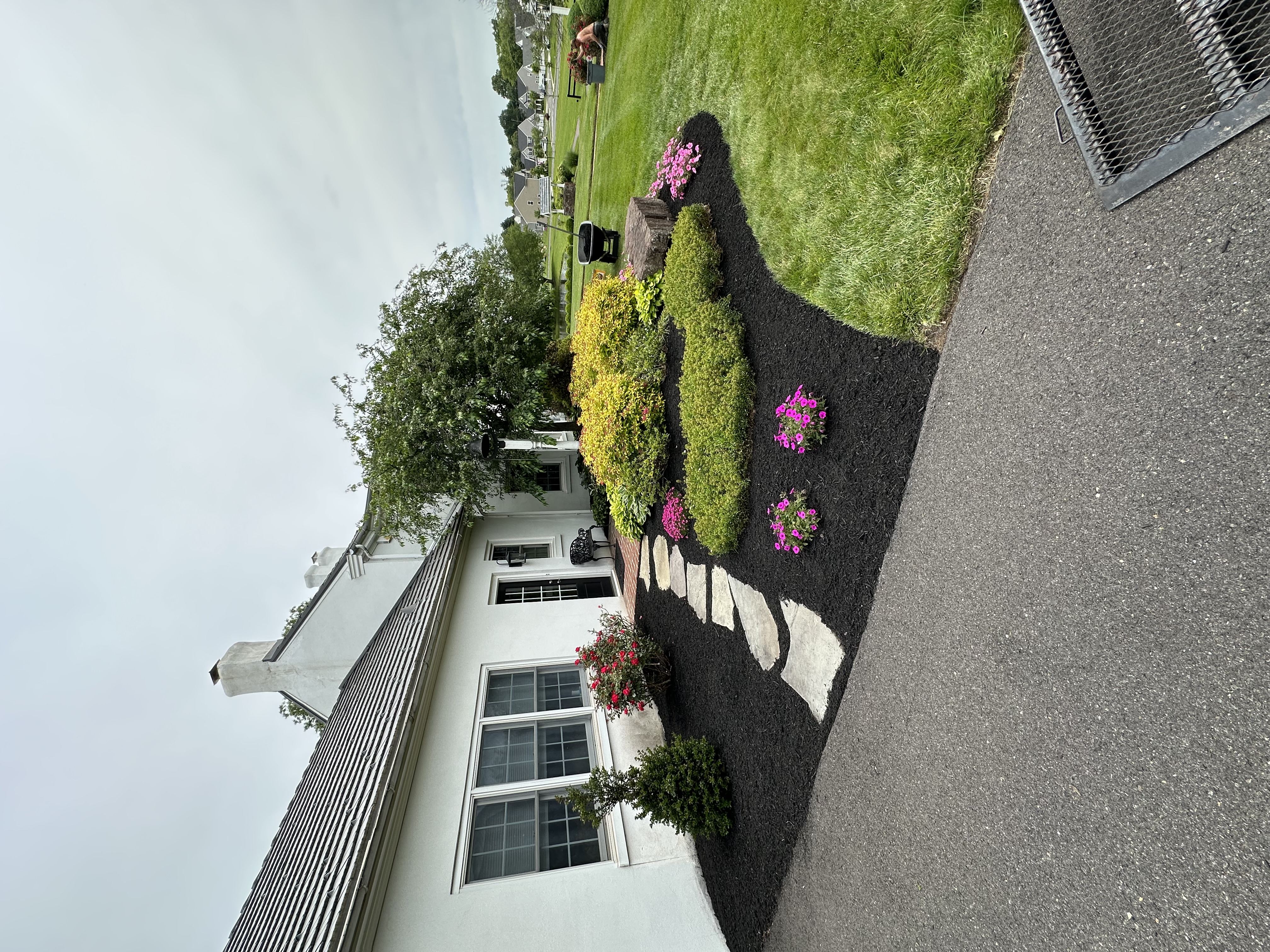Mulched garden bed with stone walkway