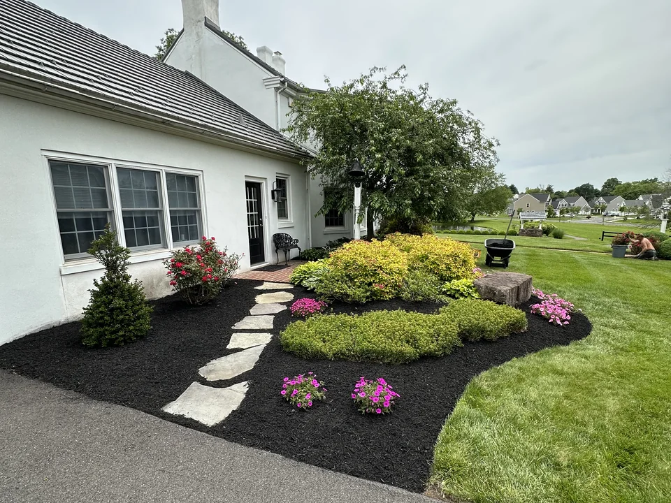 Mulched garden bed with stone walkway